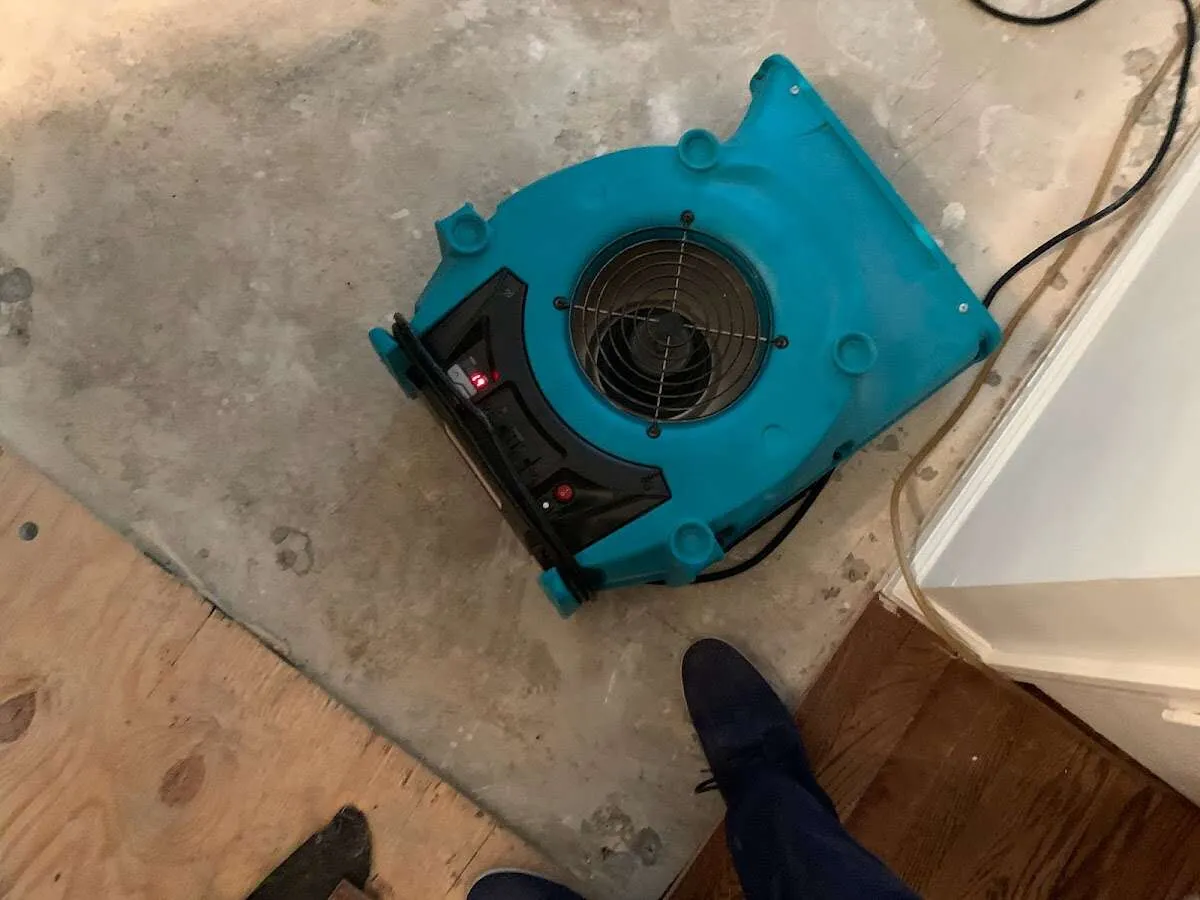 Air mover drying subfloor during Leak Detection & Repair in Irvine